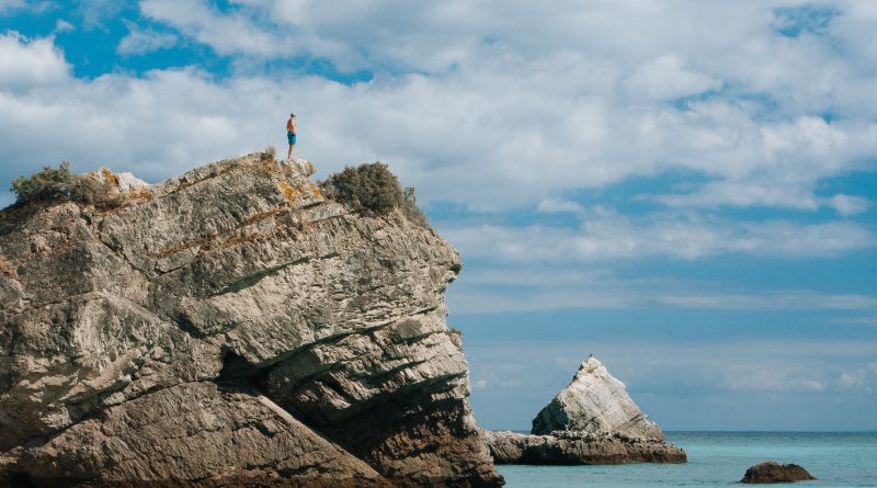 man standing on cliff