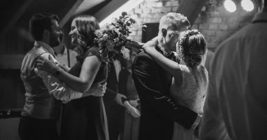grayscale photo of man and woman kissing